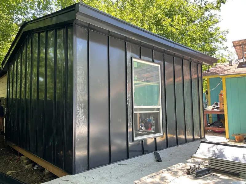 Black standing seam metal wall panels for Roof Inspection in Belmont